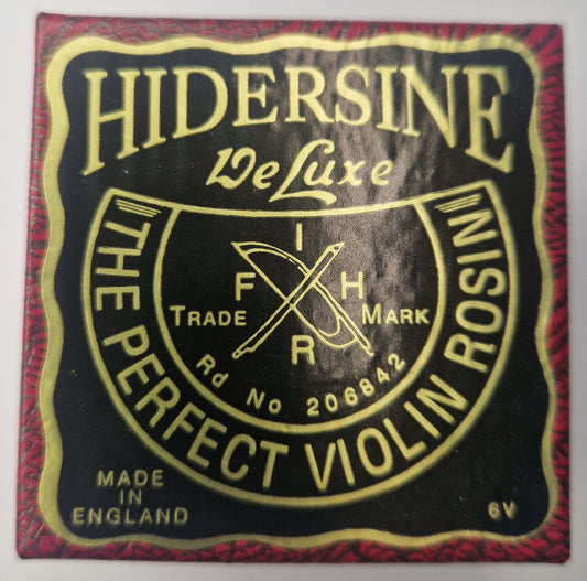 Hidersine rosin packaging with gold text on a black background